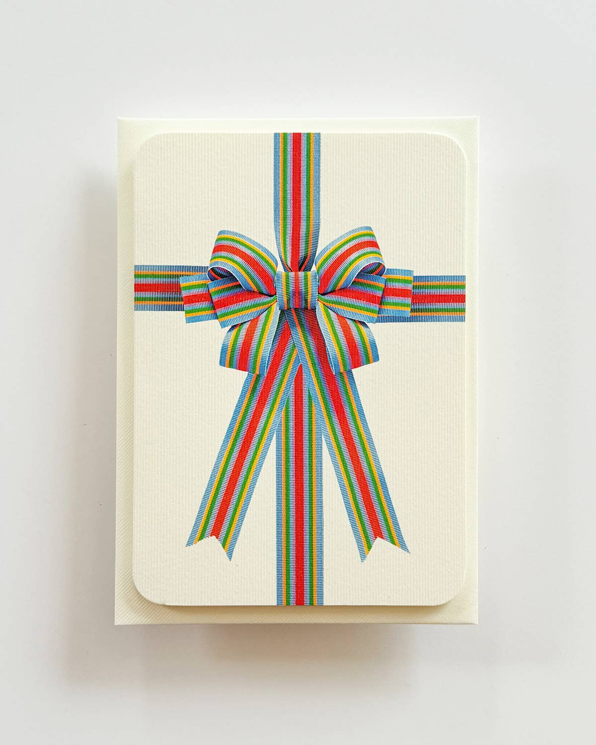 Biglietto di auguri con fiocco a strisce di caramelle