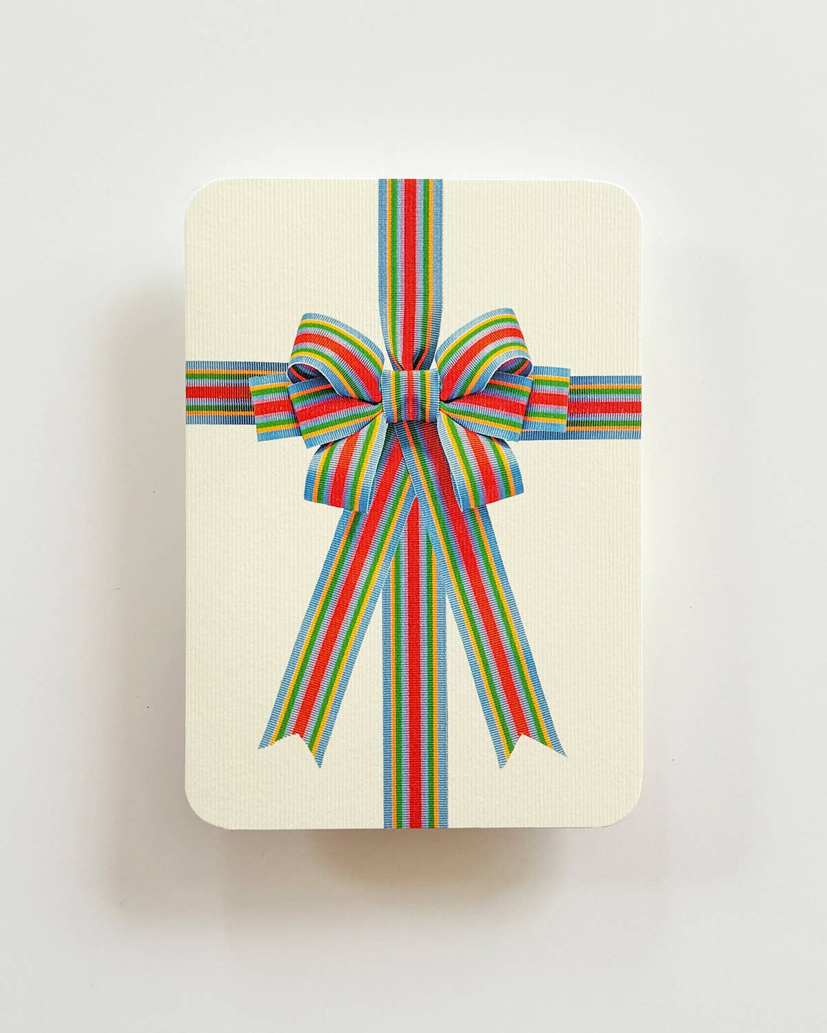 Biglietto di auguri con fiocco a strisce di caramelle